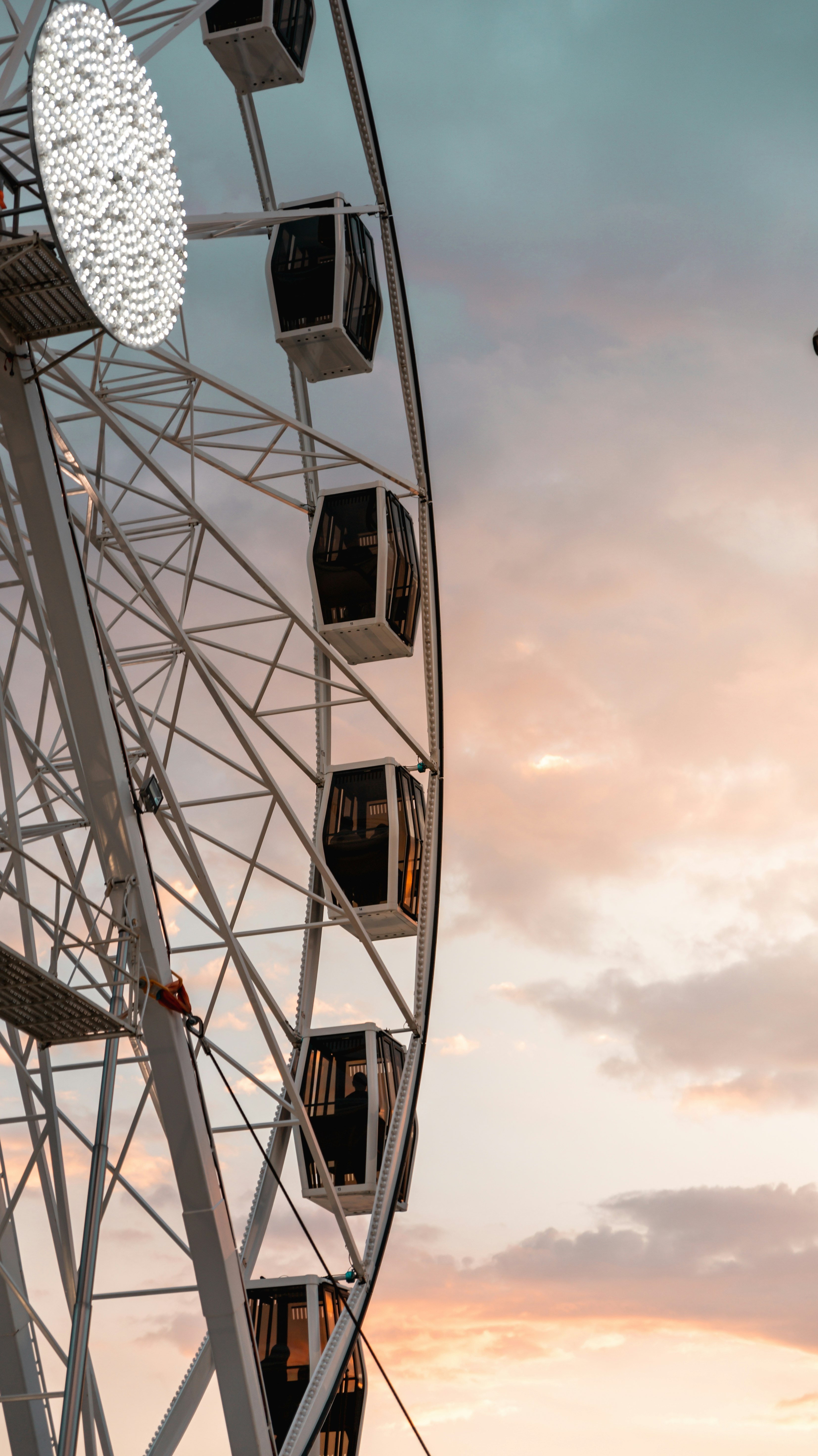 white and black ferris wheel under blue sky during daytime